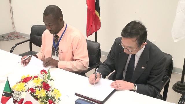 Mr. Masatoshi Sato, Minister-Counsellor and Deputy Head of Mission at the Embassy of Japan to St. Kitts and Nevis signs grant contract documents and Memorandum of Understanding with Director of the Nevis Disaster Management Department Mr. Brian Dyer at a signing ceremony at the Emergency Operations Centre, Long Point on March 15, 2017